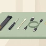 Vape pen with a blinking light next to a troubleshooting kit of cable, cotton bud and screwdriver